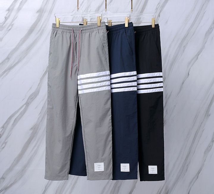 THOM BROWNE 톰브라운 042 사선 테크니컬 나일론 트랙 팬츠